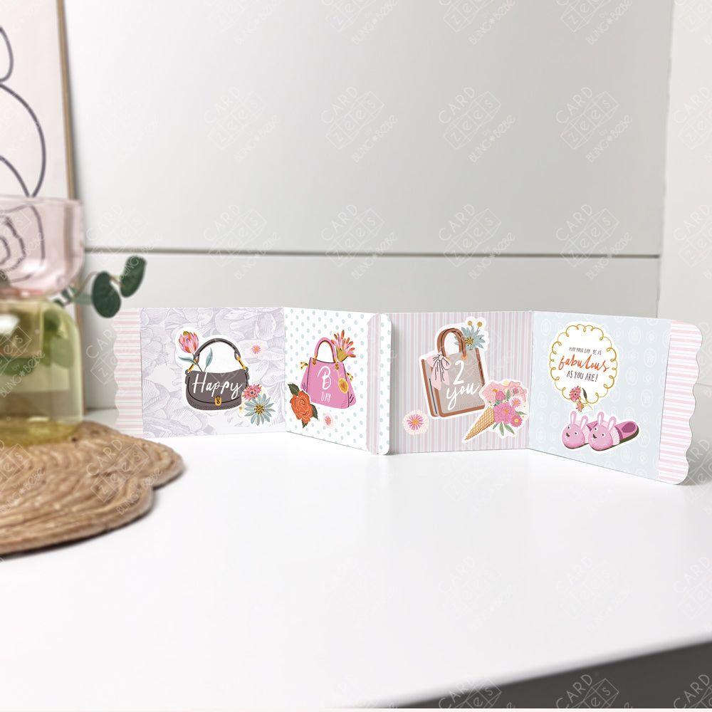 Cute stickers plus interlocking panels easily make a storybook-style unique birthday card. Decorative interlocking card strip with floral and product illustrations on a patterned surface.